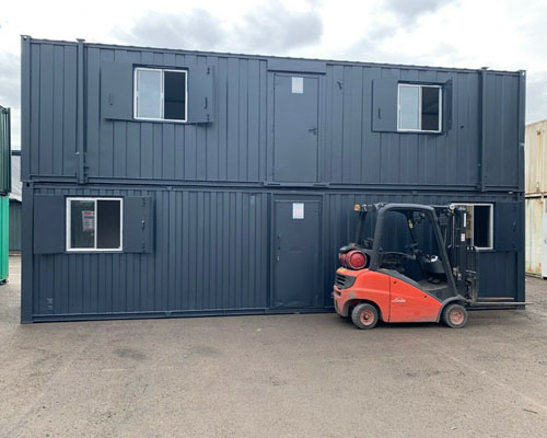 view of the exterior of the forest green portable office